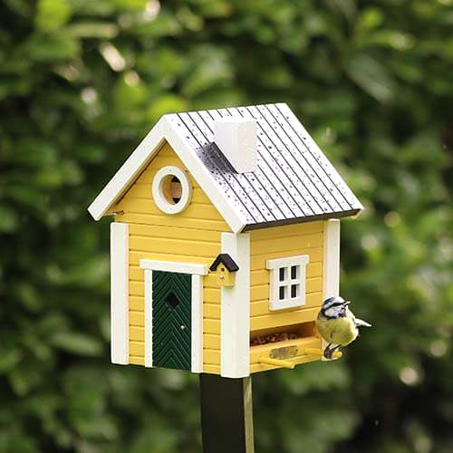 maison miniature de qualité pour les oiseaux et utile toute l'année grâce à sa double fonction nichoir et mangeoire